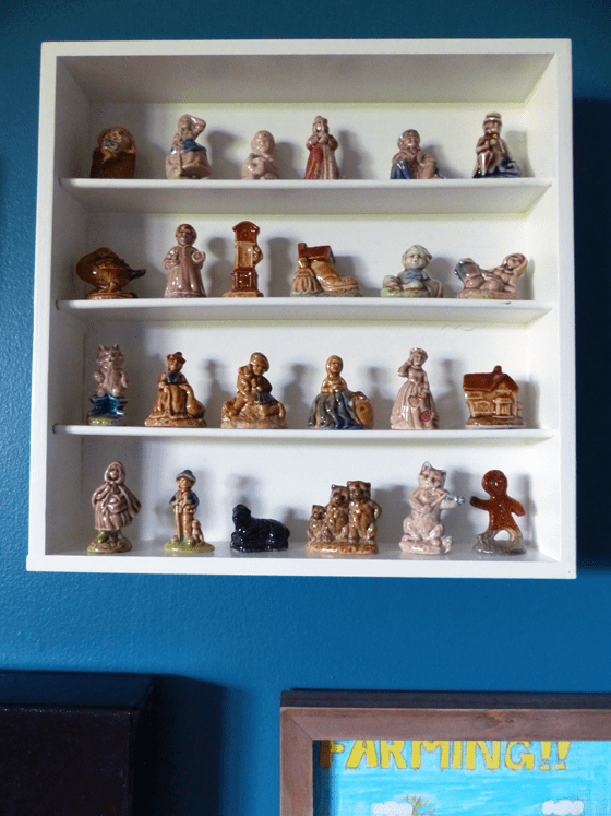 Red Rose Tea figurines displayed on a cutlery tray made into a shelf