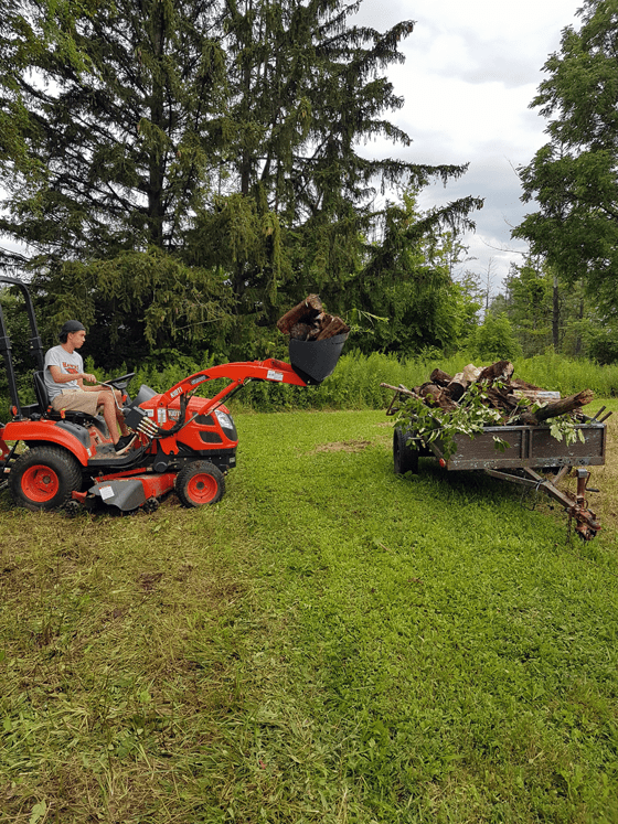 Loading firewood with the front end loader