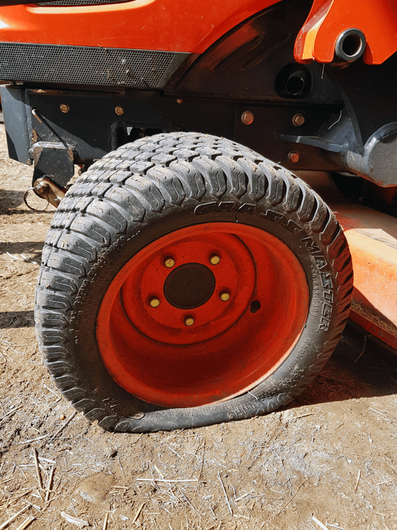 Flat tire on a Kioti CS2410