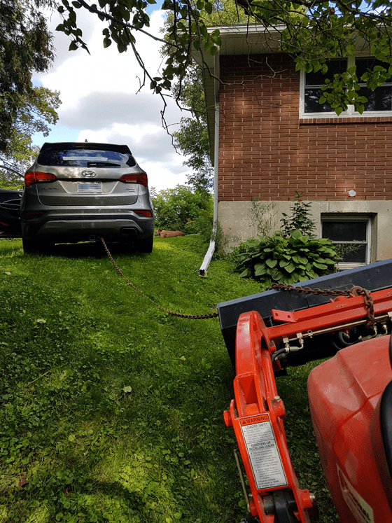 Towing the tractor with the car