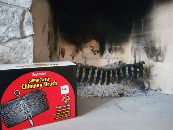 Chimney brush in front of the hearth