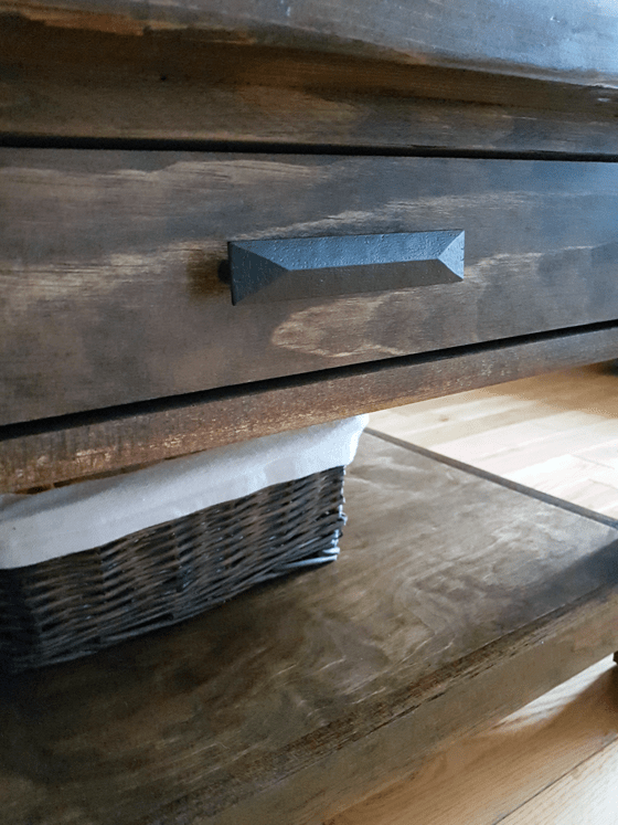 Black drawer handles on the coffee table