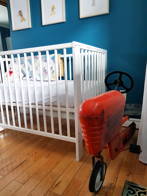 Vintage pedal car tractor in the nursery