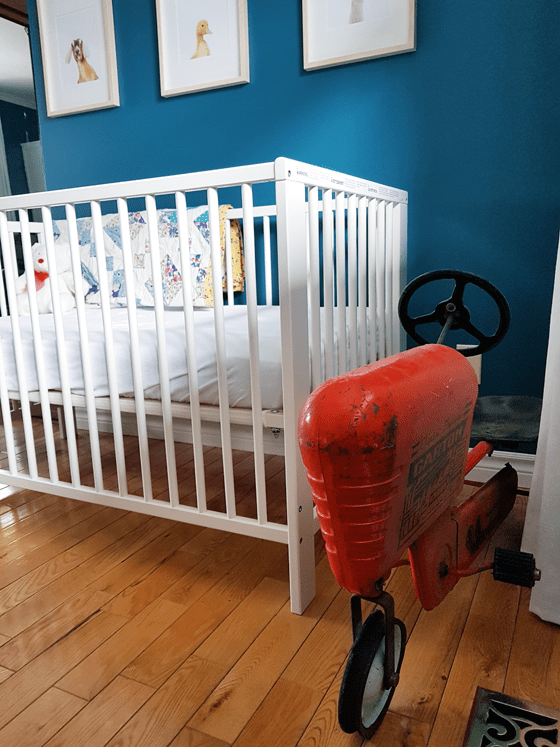 Vintage pedal car tractor in the nursery