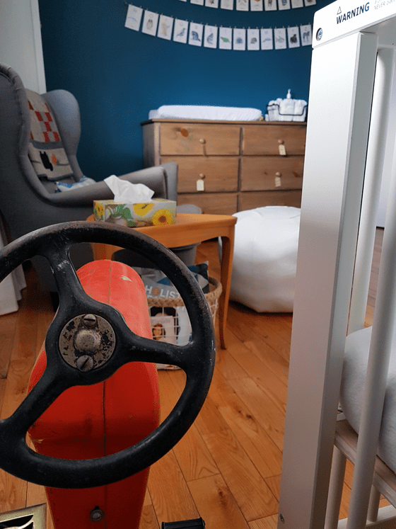 Vintage pedal car tractor in the nursery