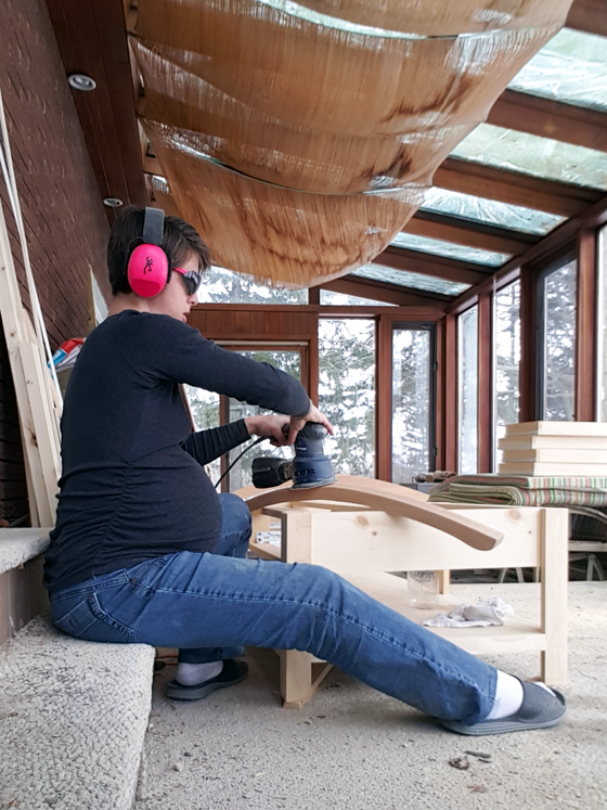 Pregnant lady sanding