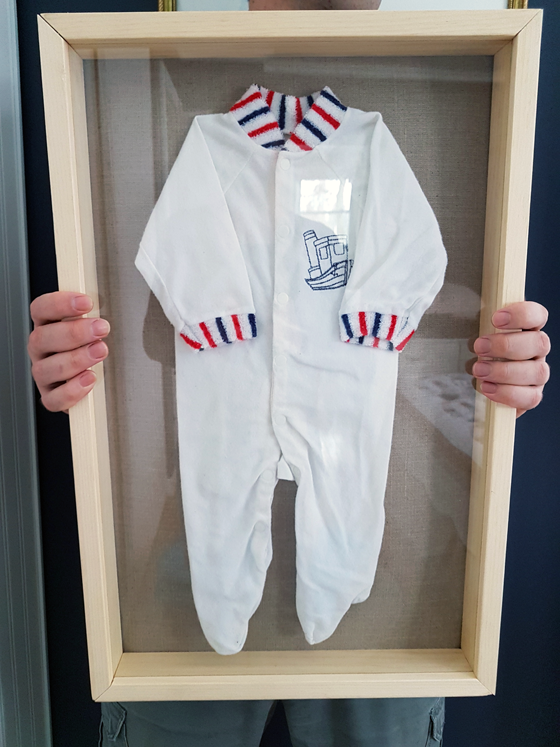 Baby sleepers framed in a homemade shadowbox