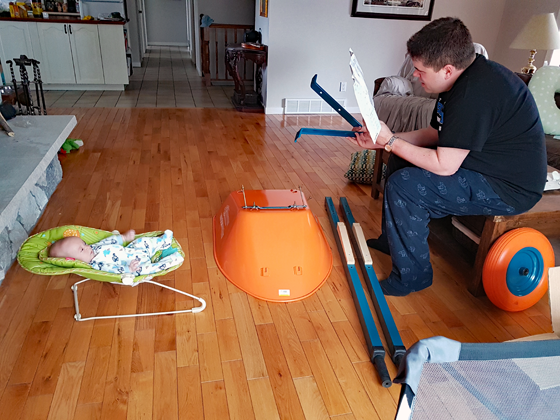Matt and Ellie assembling the wheelbarrow