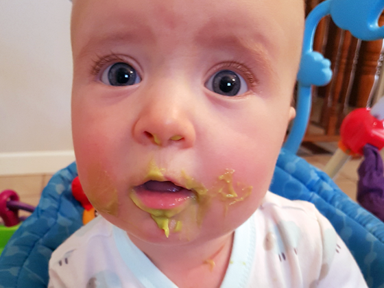 Ellie eating food for the first time