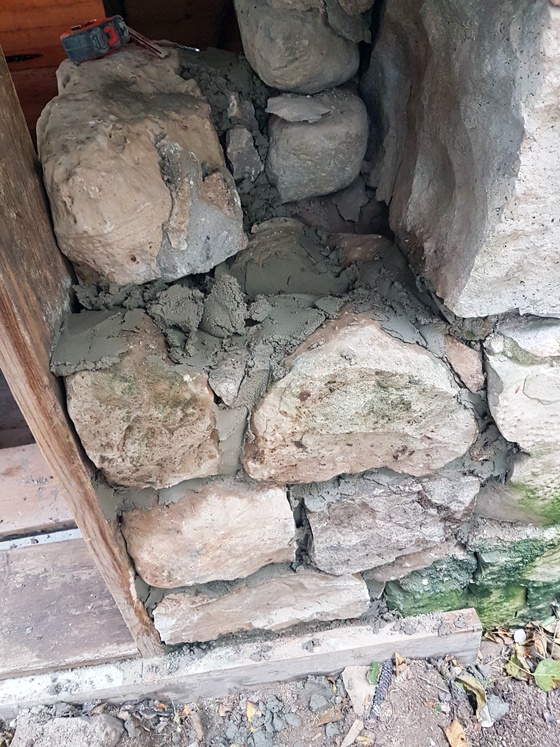 Repairing a stone barn foundation