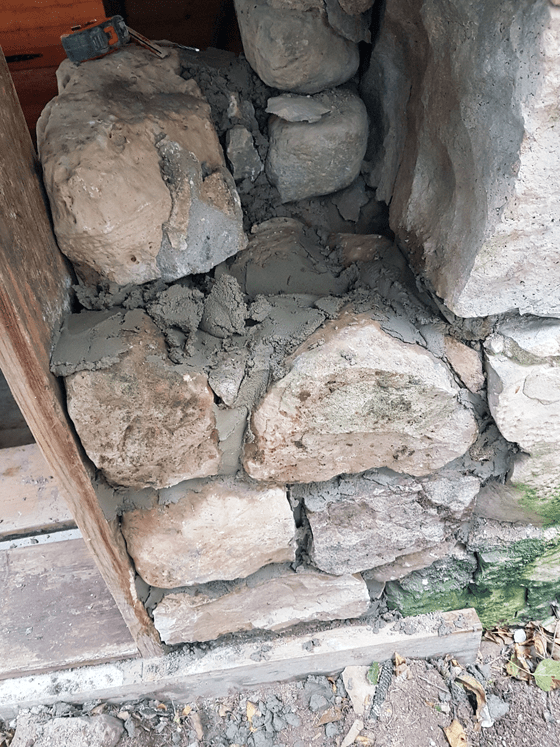 Repairing a stone barn foundation