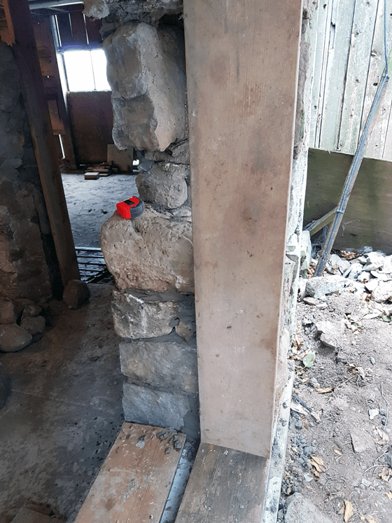 Repairing a stone barn foundation