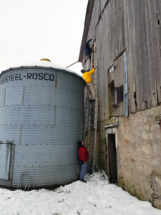 Patching wood siding on a barn