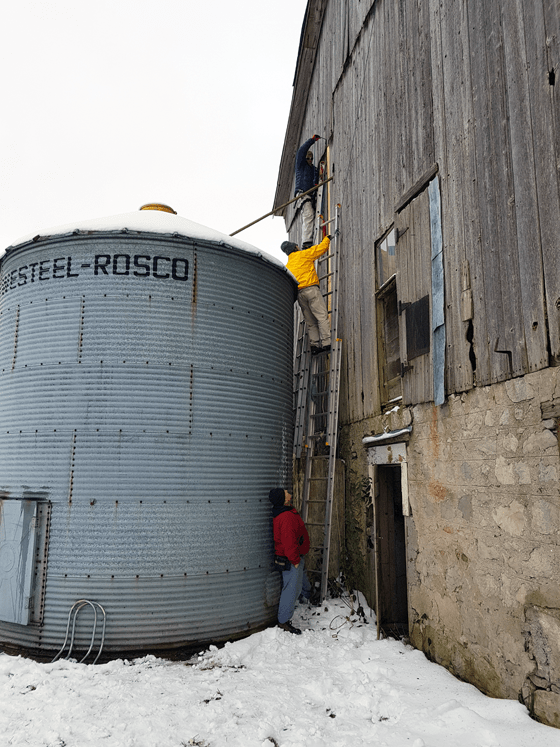 Patching wood siding on a barn