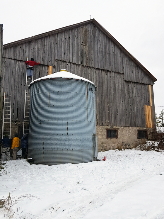 Patching wood siding on a barn