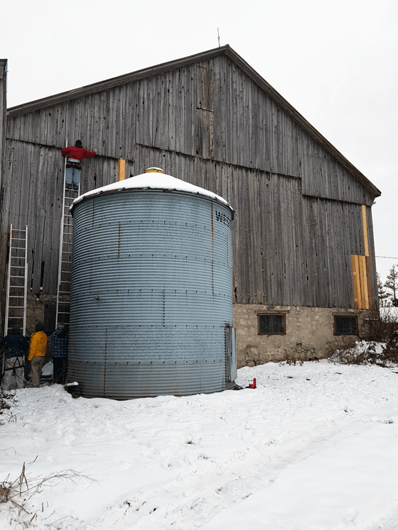 Patching wood siding on a barn