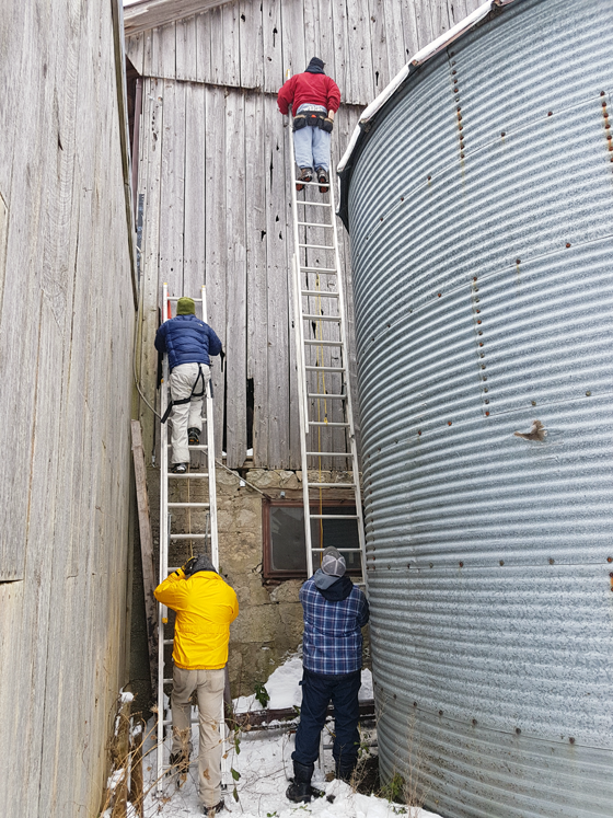 Patching wood siding on a barn