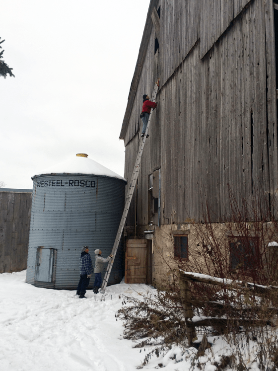 Patching wood siding on a barn