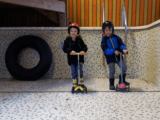 Riding scooters in the indoor pool