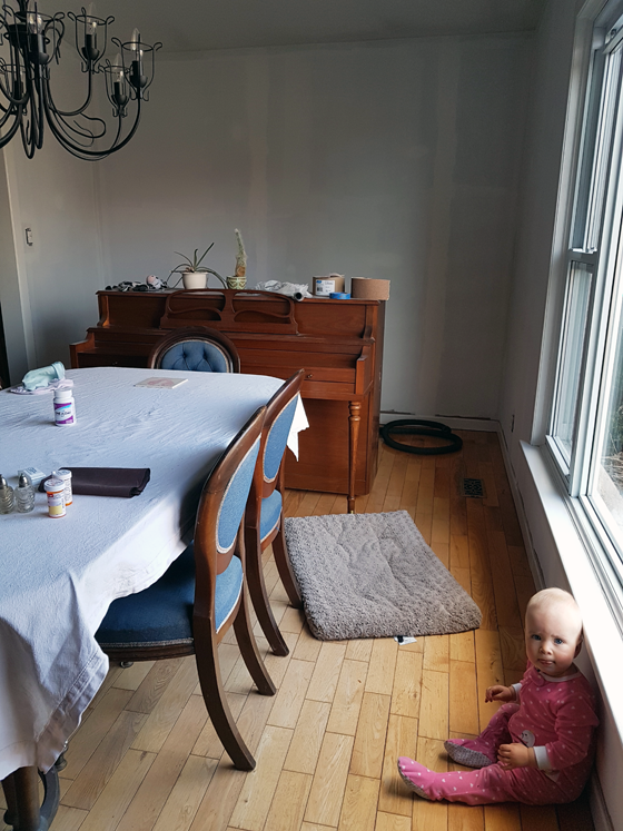 Ellie in the primed dining room