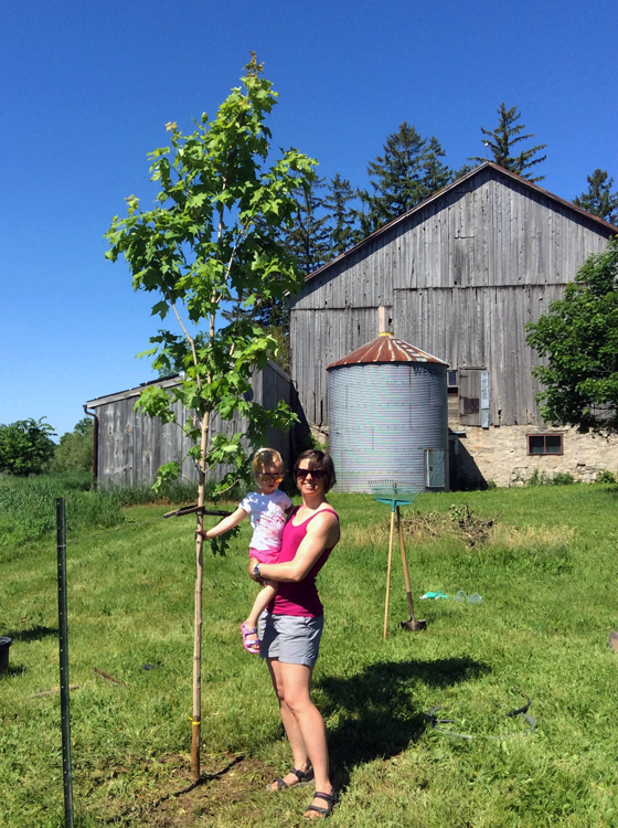 Standing by Matt's tree