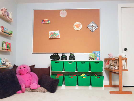 Cork board art display in our toddler's playroom