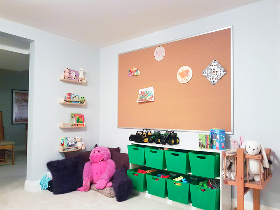 Cork board art display in our toddler's playroom
