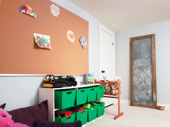 Cork board art display in our toddler's playroom