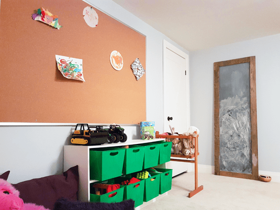 Cork board art display in our toddler's playroom