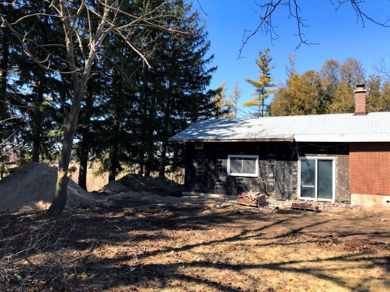 House with brick partially removed