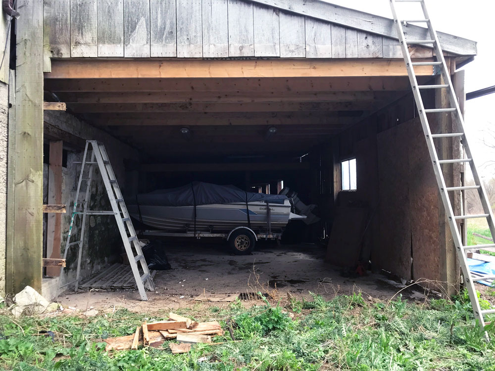 Opening in the side of the barn with ladders