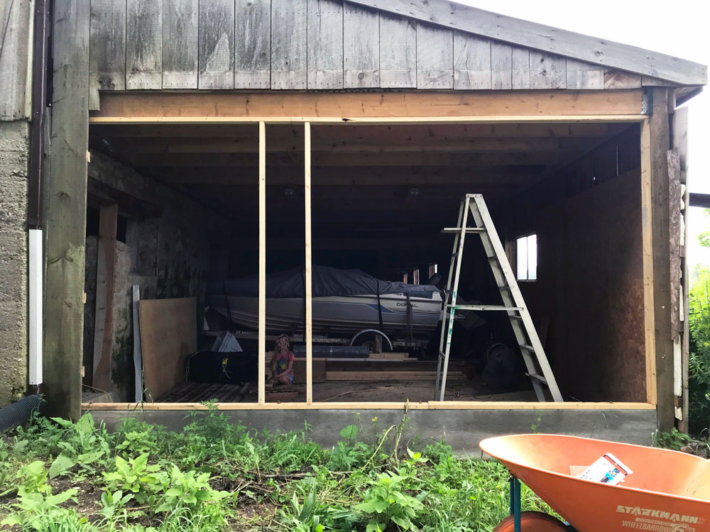 A new wall being framed for the exterior of a barn